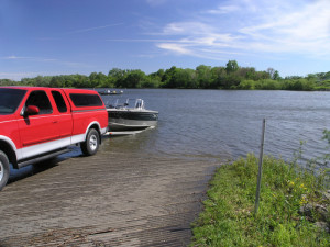 Truck Launching Boat Into Lake