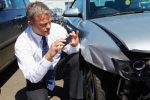 Insurance Adjuster Taking Pictures