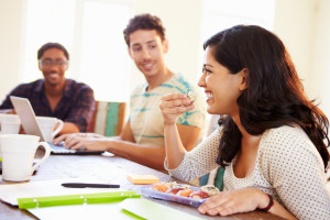 Business People Having Meeting And Eating Sushi