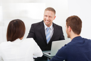 Accountant Discussing With Couple